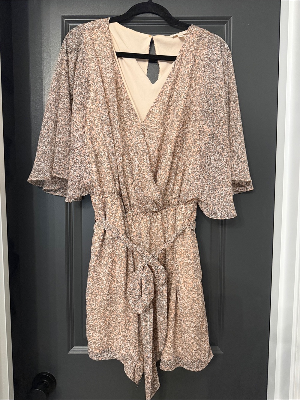 Charming Charlie Floral Wrap Mini Romper in Beige Pink